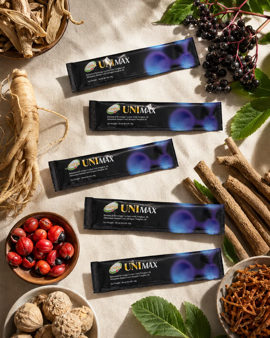 UNI MAX sachets laid out with Tongkat Ali root, ginseng and botanical ingredients